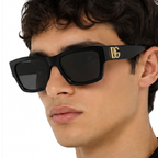 Dolce & Gabbana Slim Rectangular Black Sunglasses (DG 4540) worn by a model