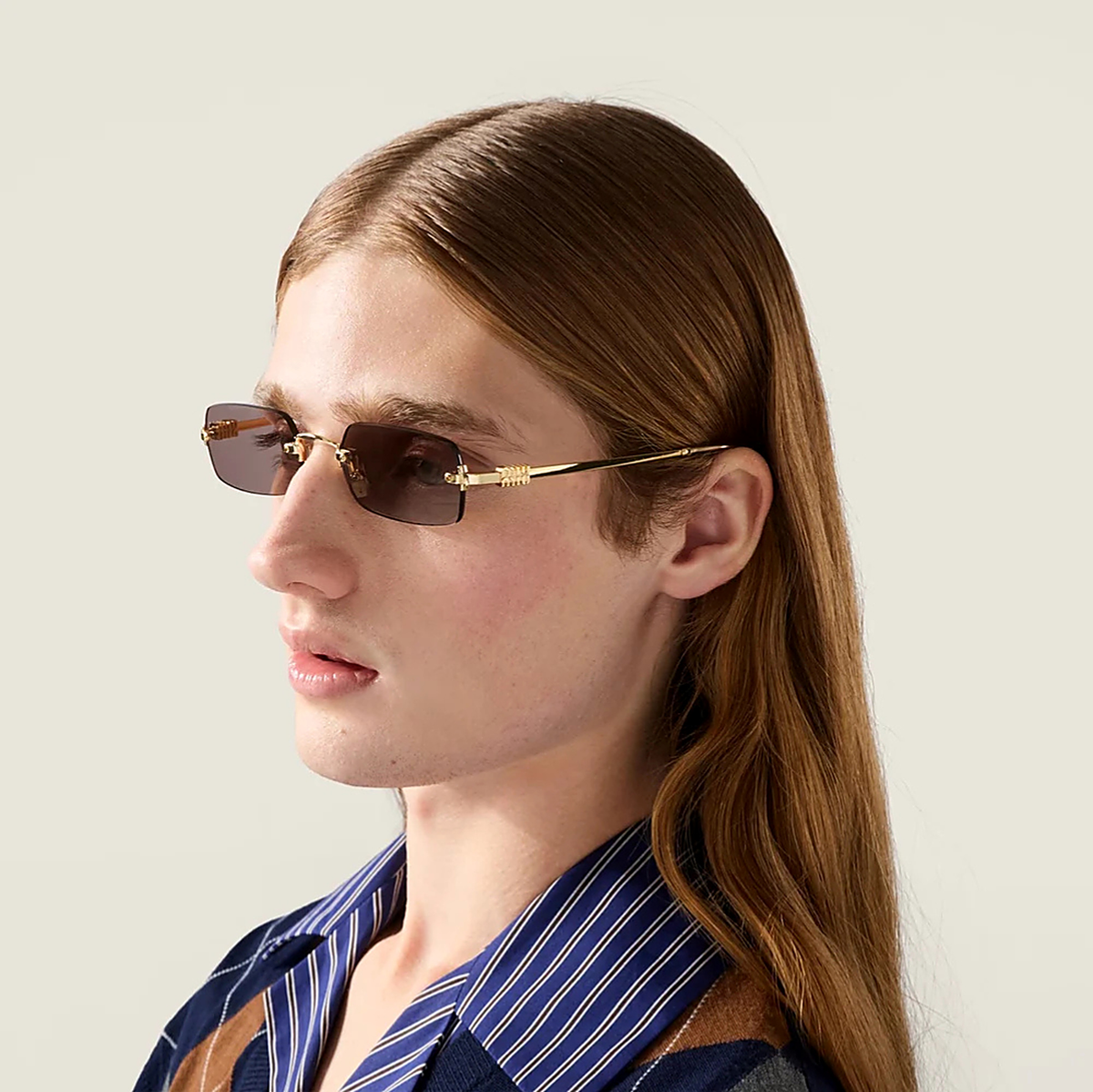 Miu Miu Red Sunglasses (SMU B50) worn by a model