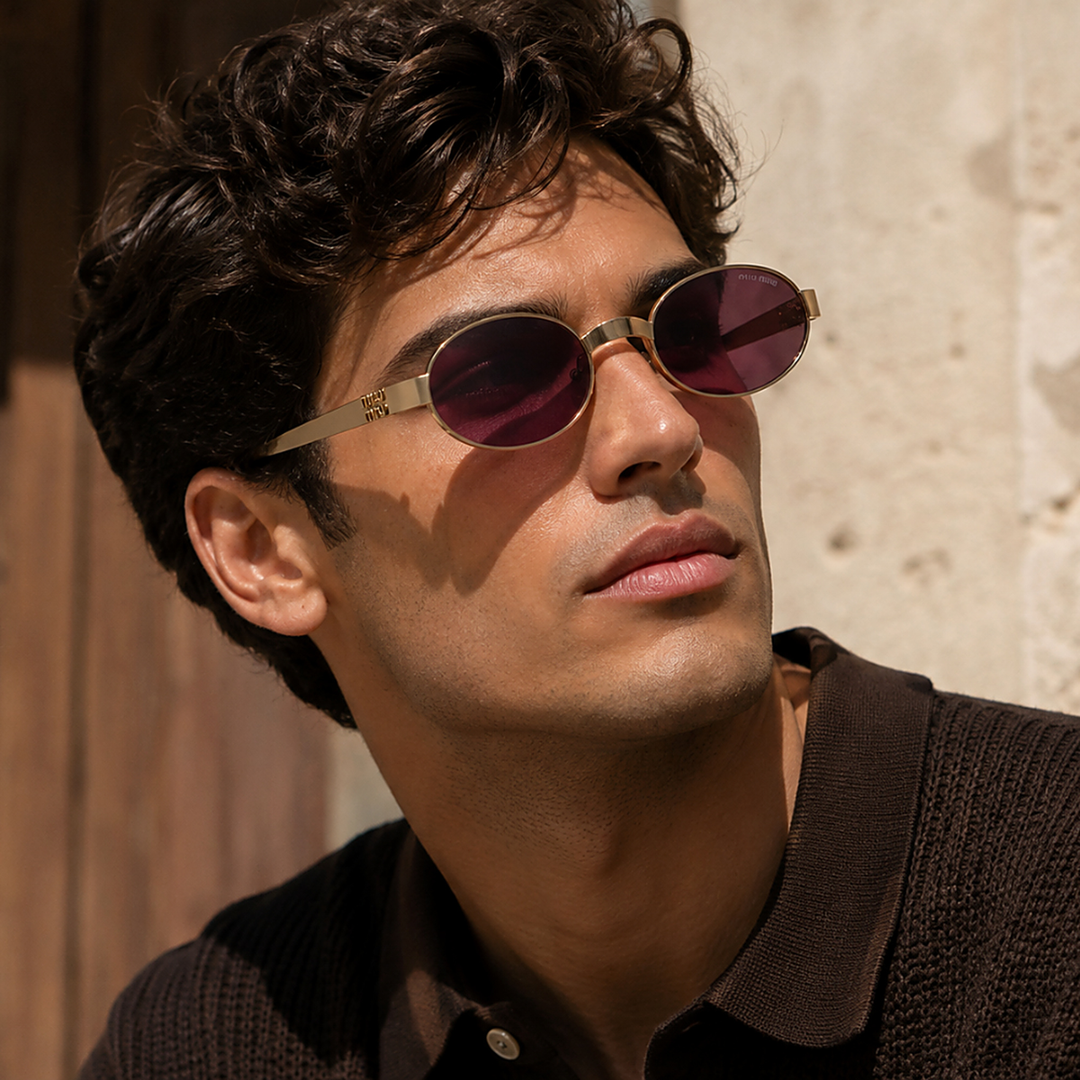 Miu Miu Oval Gold Sunglasses (SMU B51) worn by a model