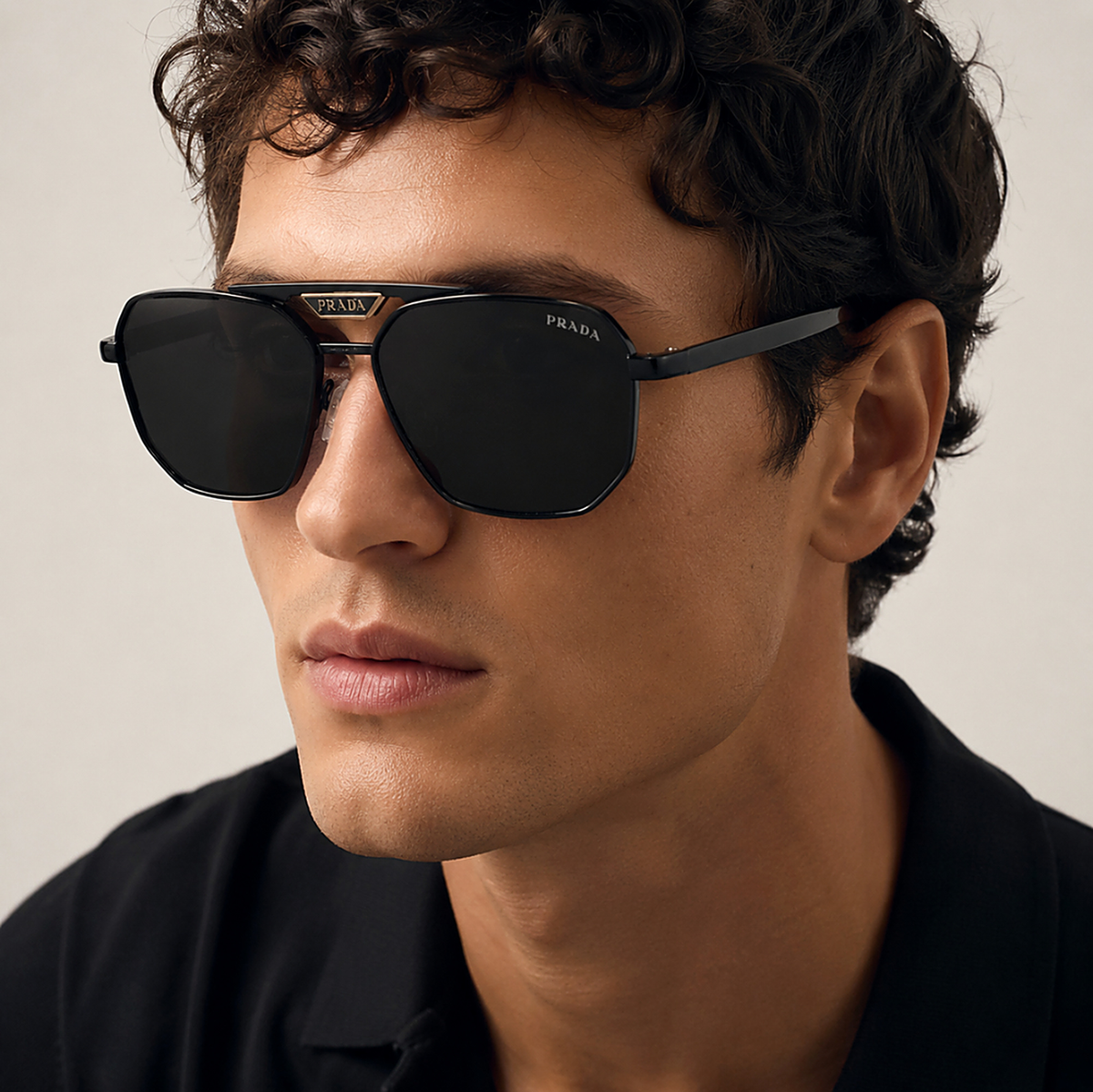 Prada Navigator Black Sunglasses (SPR A17) worn by a model